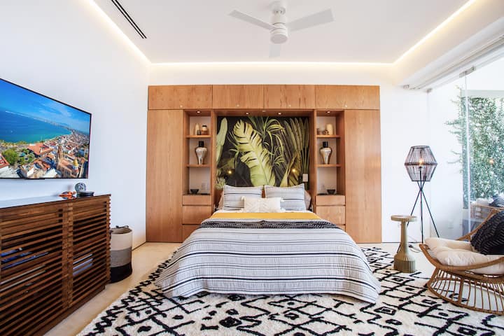 The spacious second bedroom, with bed down, has views of the bay. 