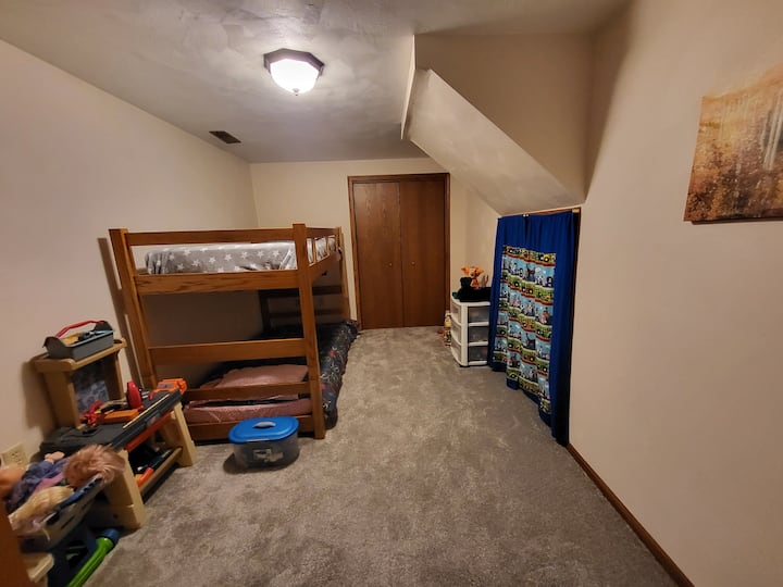 The bunkroom for children with toys and books.