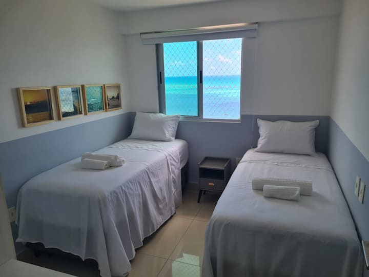 Room with two box beds and a built-in bed.