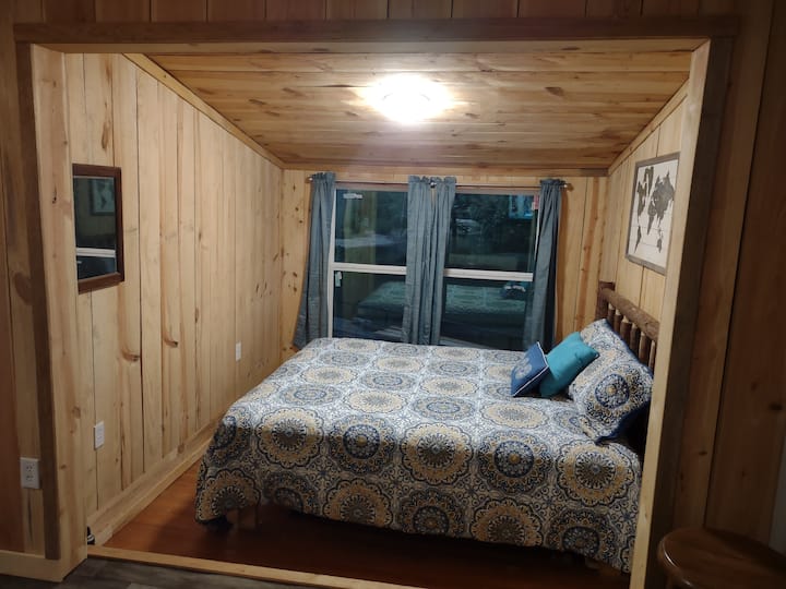 The bedroom is just big enough for an oversized queen bed.  Deer are often spotted just outside the window with the river just beyond.