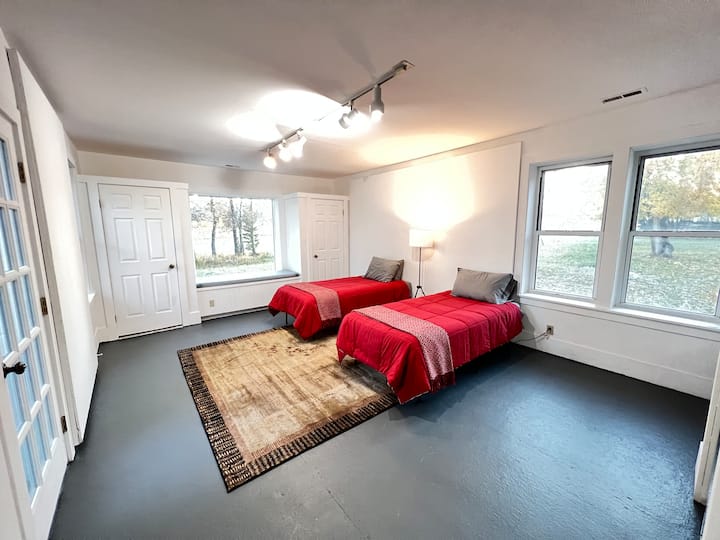 Twin bedroom with window seat.