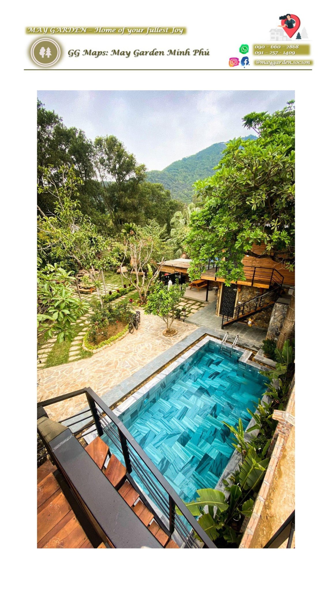A tranquil outdoor area is showcased, featuring a shimmering pool with blue tiles, surrounded by lush greenery and stone pathways. Sun loungers are positioned nearby under the shade of trees, creating a serene retreat set against a mountainous backdrop.