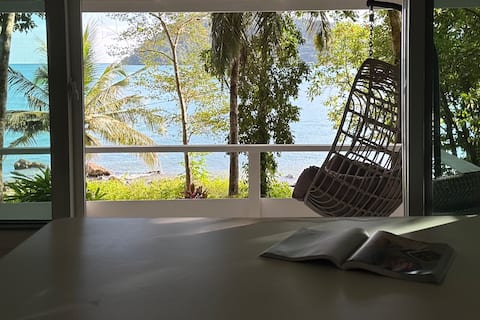 Spacious house by the sea in the shade of trees