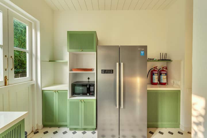 ✨Sleek appliances meet charming vintage cabinetry in this thoughtfully designed kitchen nook, where form and function come together in refreshing mint and steel tones✨