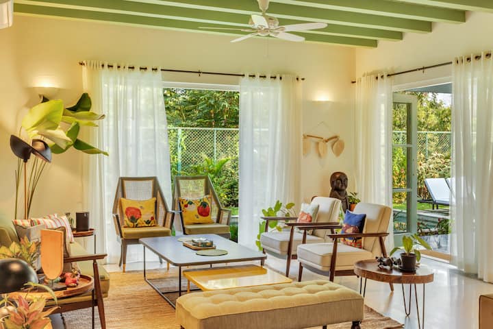 ✨A sun-drenched living room that radiates joy — think leafy views, rattan charm, curated art, and a palette that makes every corner Instagram-worthy✨