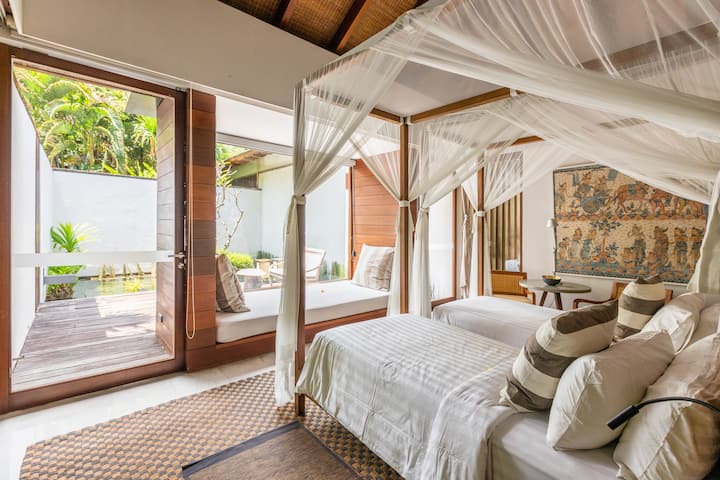 シングルベッドの構成を備えたゲストヴィラ 