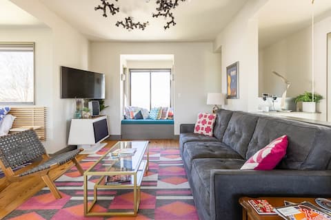 Curl up in the Window Seat at a Colorful Modern Treehouse