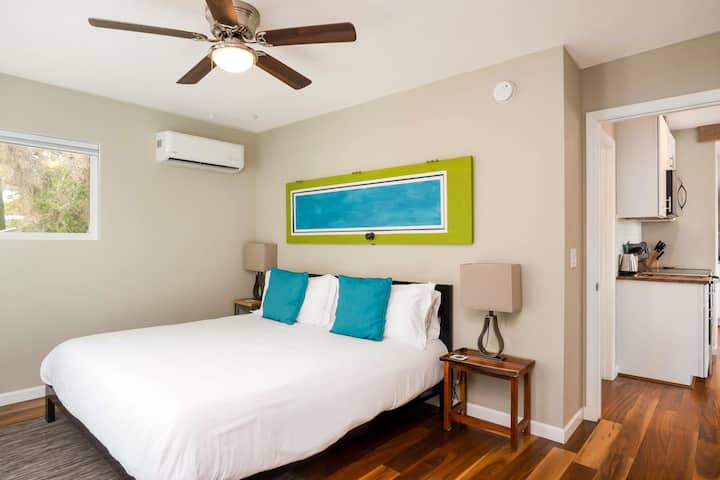 Bedroom #4 located upstairs with a King size bed - French doors lead you directly out to your outdoor patio / deck