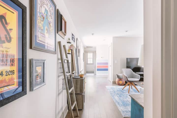 This is no ordinary wall. This right here is our Music City Hall of Fame, adorned with local band posters and QR codes to exclusive @lightysroost Spotify playlists, to boot.