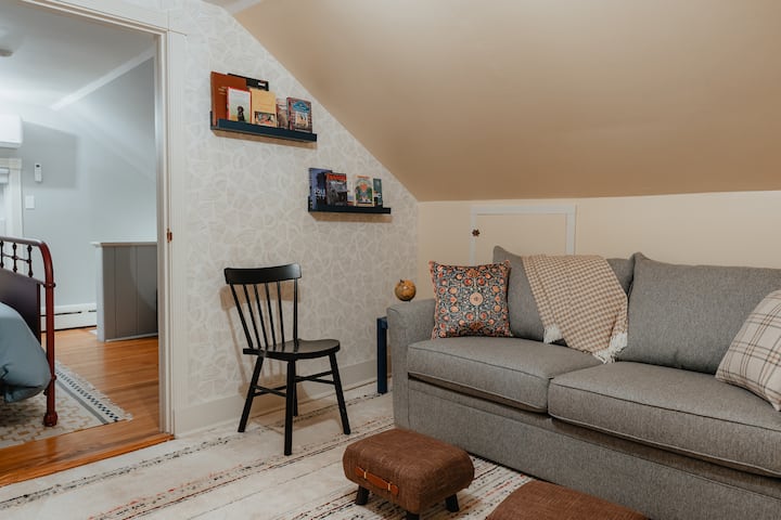 The Reading Bedroom is a flex space that can be used as another seating/reading area but also doubles as a bedroom. The full sized mattress pull out couch is top of the line and a very comfortable sleeping option.  There is a work desk and a full clo
