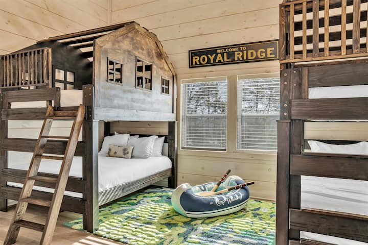 Treehouse Room with queen-over-queen beds, TV, and ensuite bath.
