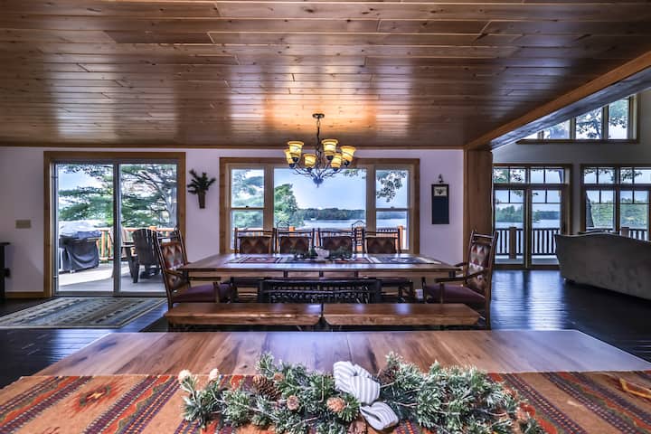 Large lakefront log cabin with deck, firepit, dock