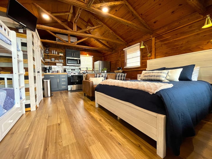 Cozy cedar cabin with exposed natural beams.