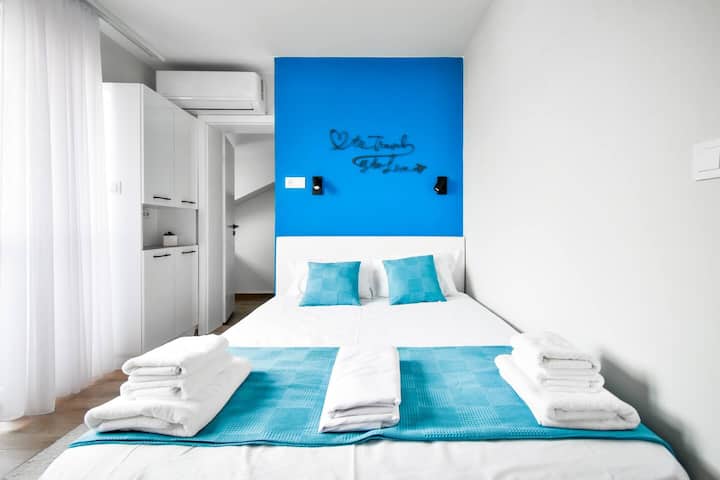 Cozy up in our queen-sized bedroom, complete with ample wardrobe space and soft lighting. Perfect for a restful stay. Questions? We’re here to help!