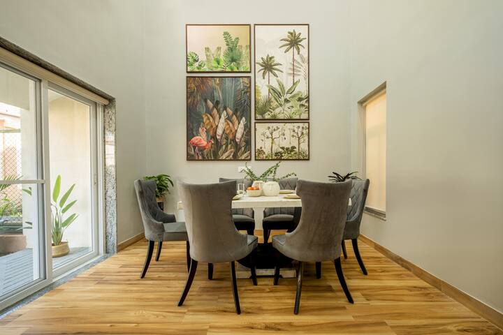 Dining area with a table and chairs for enjoying meals together.