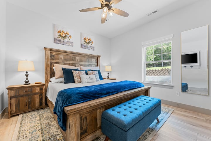 Bedroom #1 
Enjoy a comfortable stay in this thoughtfully decorated bedroom with warm wooden furniture and subtle accents.