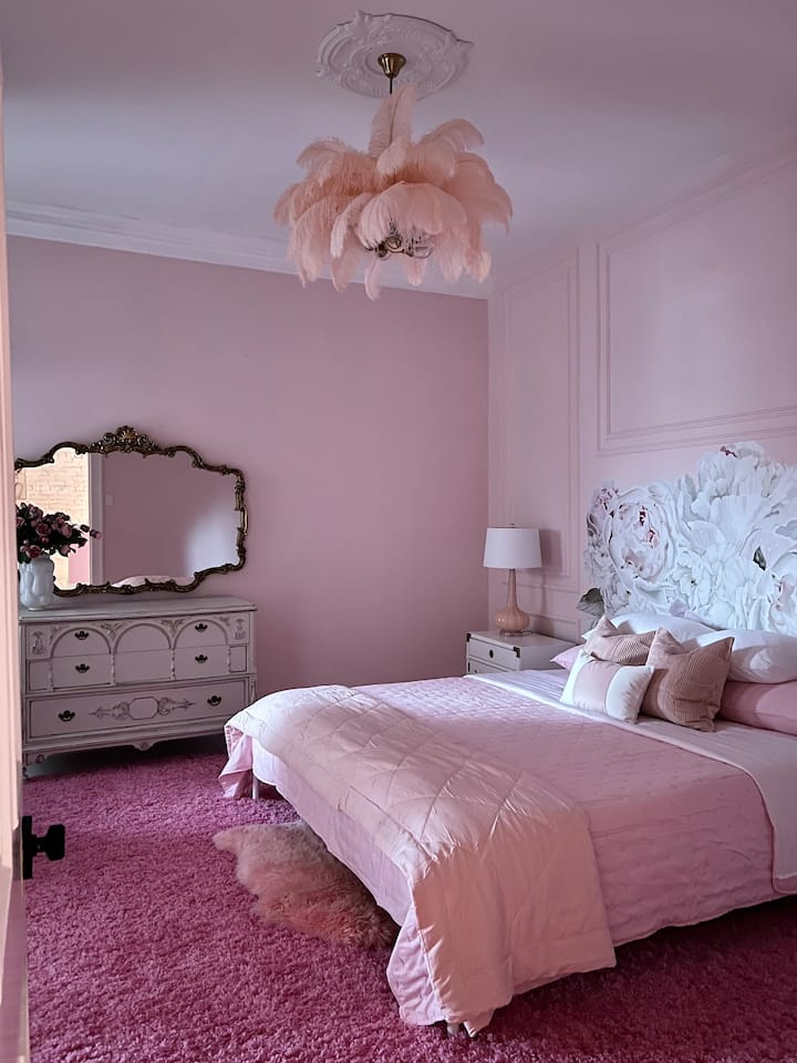 Comfy King bed with layers of pinks 