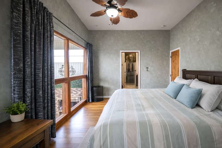 Private King Bedroom Retreat • Comfortable King Bed, Natural Light & Relaxing Atmosphere • A Quiet Place to Recharge Between Meetings, Adventures and Group Activities • Designed for Restful Nights and Productive Days in Downtown San Diego