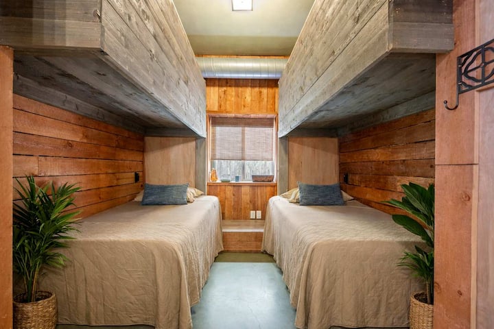 Cozy Bunk Room Designed for Groups • Comfortable Sleeping Arrangements, Warm Wood Accents and Space-Efficient Layout • Perfect for Friends, Families, Retreat Attendees and Team Members Staying Together While Enjoying Their Own Dedicated Sleeping Are