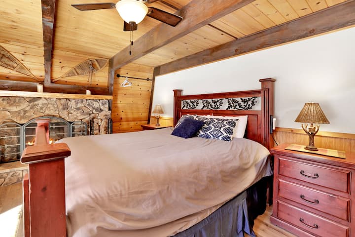 Peaceful cabin bedroom with plush bedding, and beautiful views—ideal for restful nights, cozy mornings, and a relaxing mountain escape.