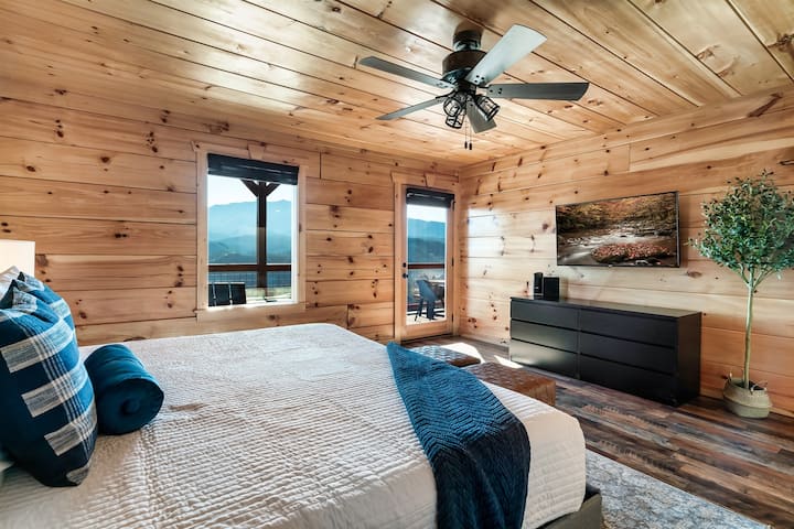 Main floor bedroom: Mountain view, smart TV, and your own access to the deck