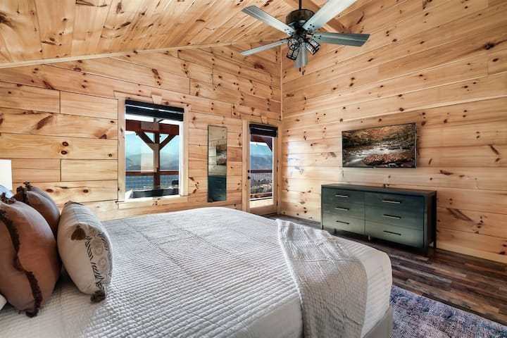 Second floor bedroom: Enjoy mountain views, a smart TV, and your own access to the second-floor deck