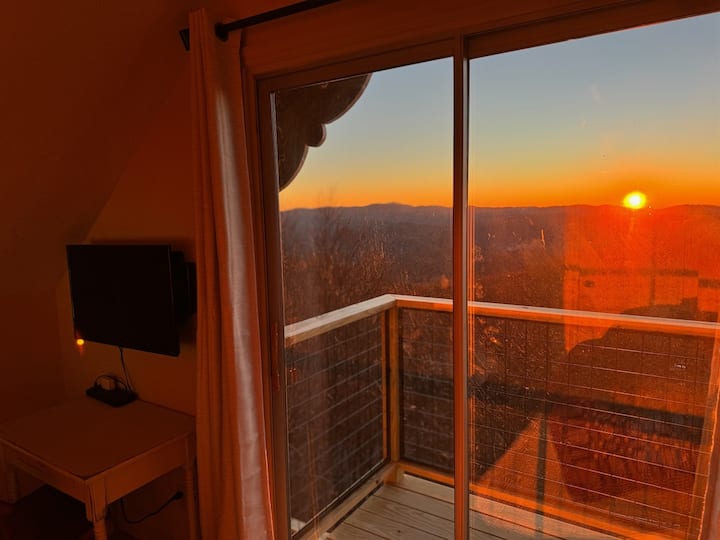 Our Top Floor Queen View Bedroom has a private balcony with sliding door to enjoy the mountain & valley views - the reason you stay in Seven Devils - high above it all! It also has a Desk, Chair, Roku Smart TV, & Twin Futon. Be nice & share that view