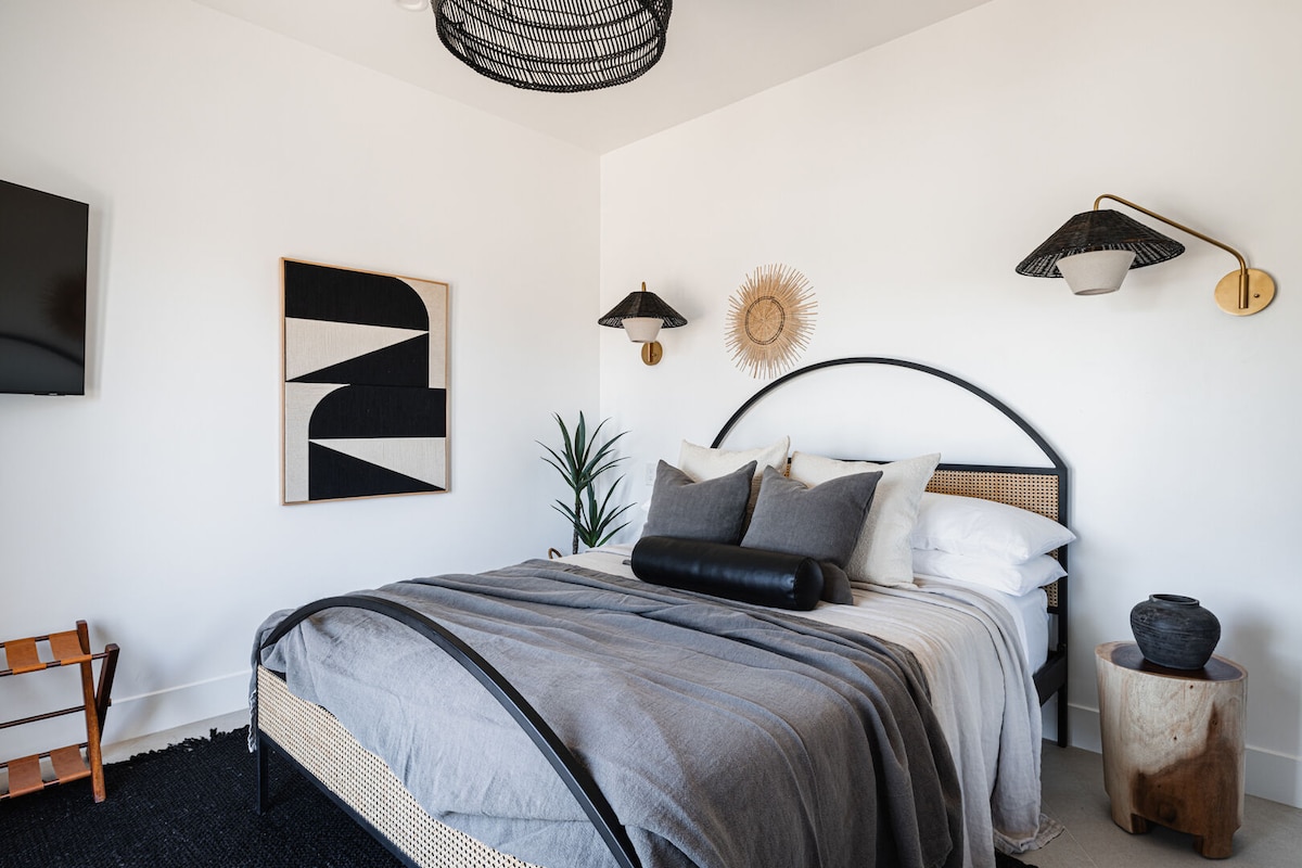 Square bedroom with king bed - accessible through Jack n Jill bathroom or through the private patio access.