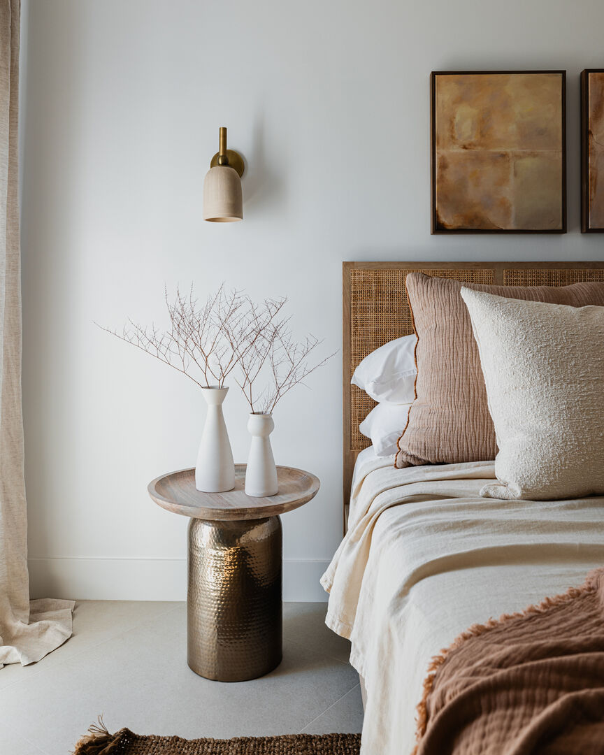 Crescent bedroom with queen bed, private en suite and patio access.