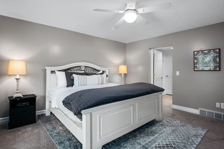 Lower level bedroom with king bed and lake views