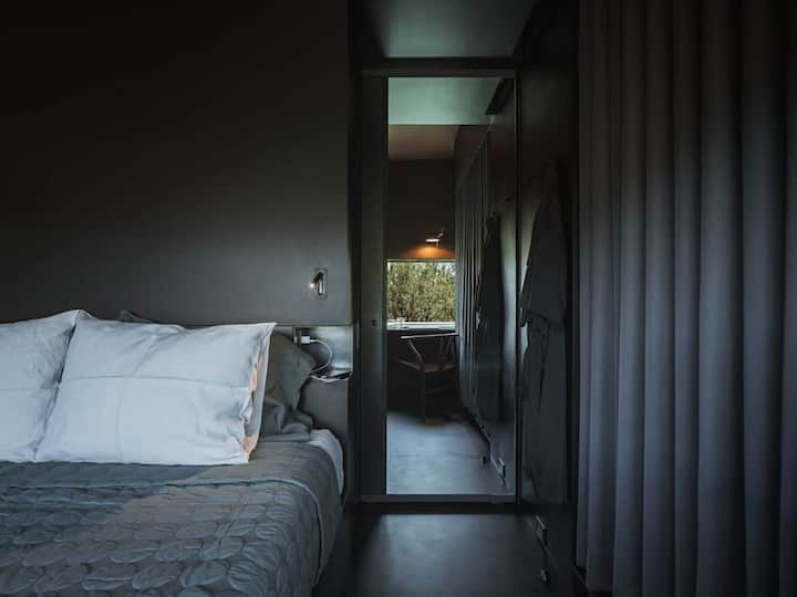 Drift into peaceful slumber in this elegantly designed bedroom.