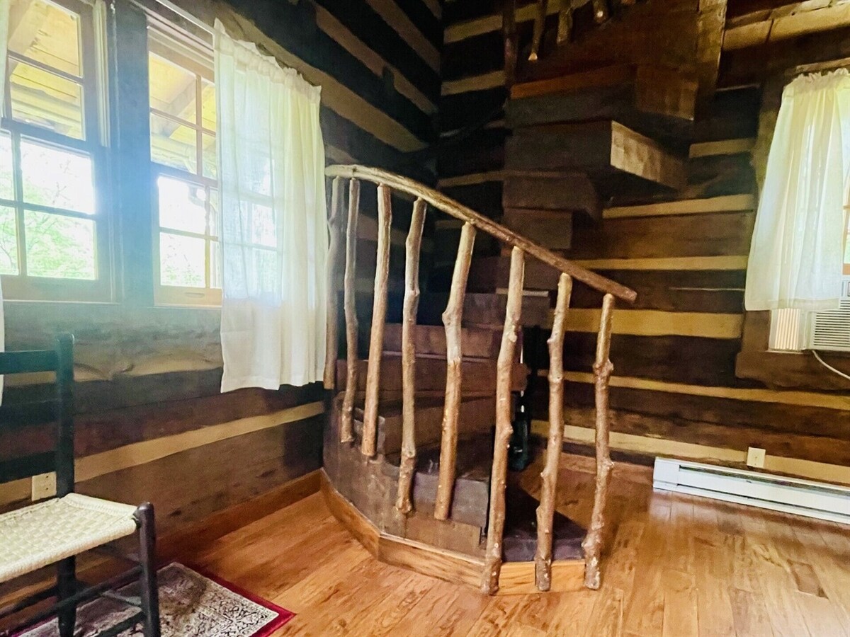 The spiral stairs to the loft area (where bed is located) are made of laurel.