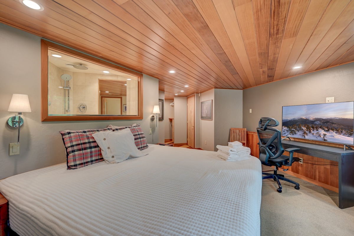 This ensuite, located on the main level provides views of the river, AC, and a TV