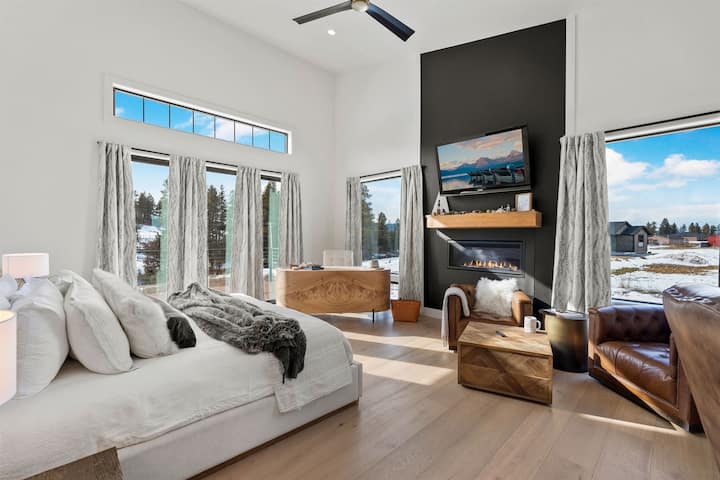 The primary bedroom features a king bed, office space, fireplace and amazing views.