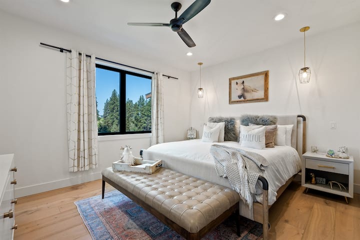 Bedroom 3 features a king bed and fantastic views of the backyard overlooking the Stillwater River