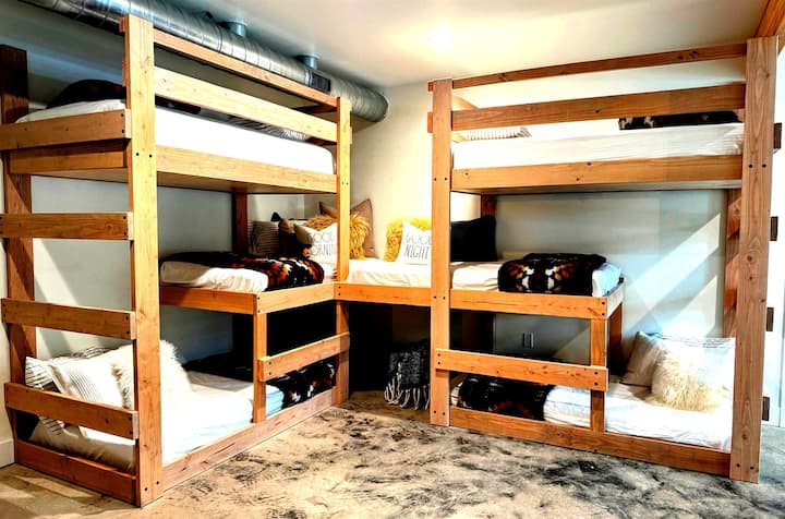 The built-in bunk bed feature SIX twin beds in a staggered bunk pattern to provide ample space between each bunk for kids and adults alike.