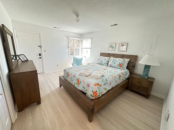 This queen bed is on the first floor and has access to outside.   It shares a bathroom with the bunk bed room.   