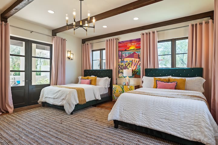 Bedroom 3 features two queen beds and a TV.