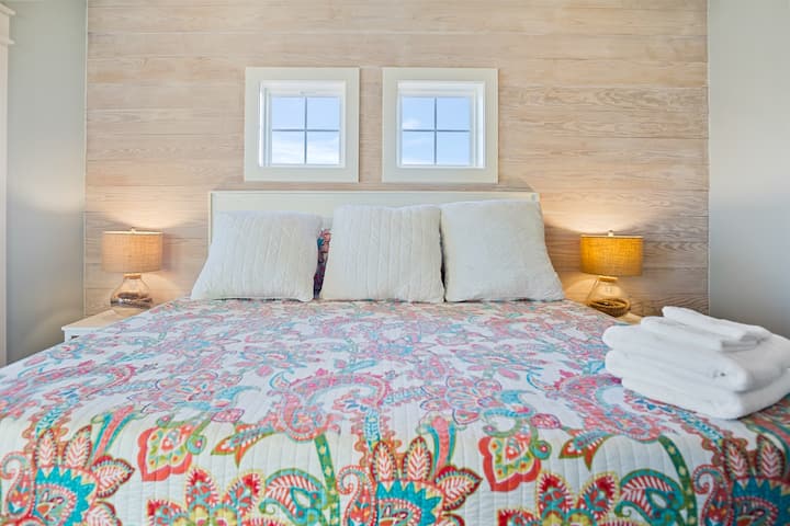 Beach Breeze Primary Bedroom 3: Second level king suite, with private door access to the upper deck and ensuite w/ closet and smart tv.