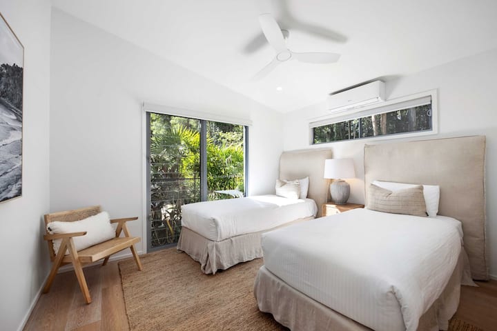 Enjoy the flexibility of a split king in bedroom two, with cooling and direct access to the outdoors.