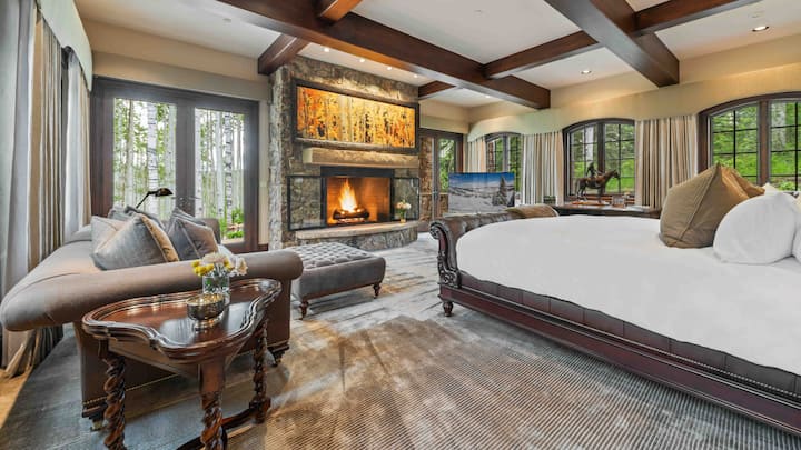 Bedroom 1, Lower Level - Primary bedroom, features a king bed and gas fireplace