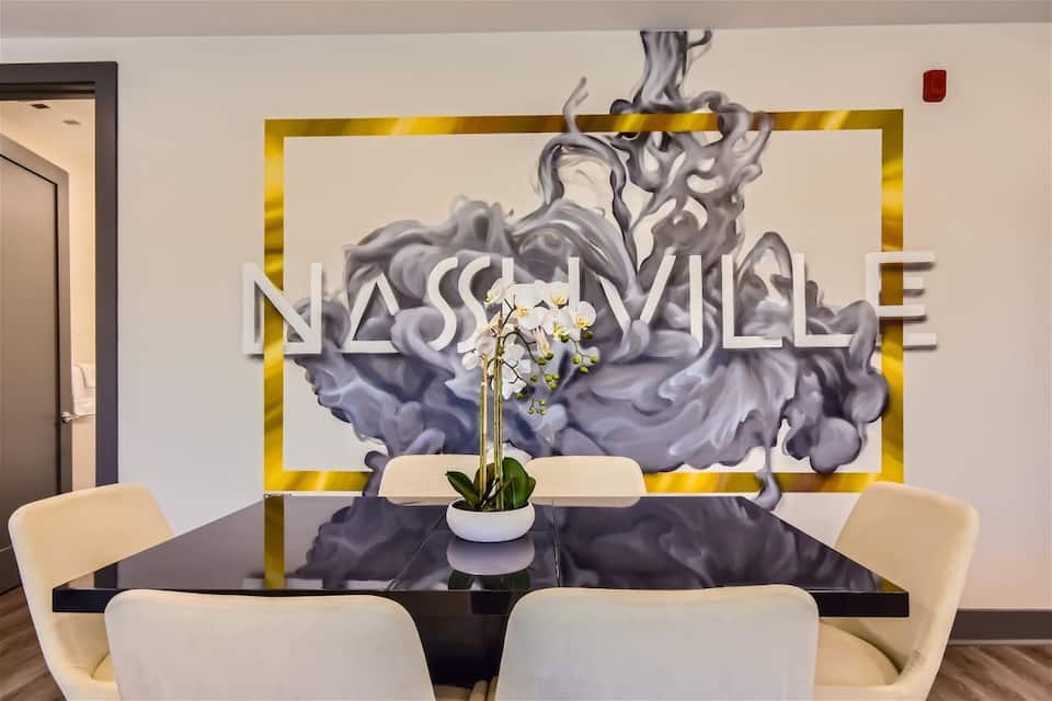 Dining table under gold pendant lighting