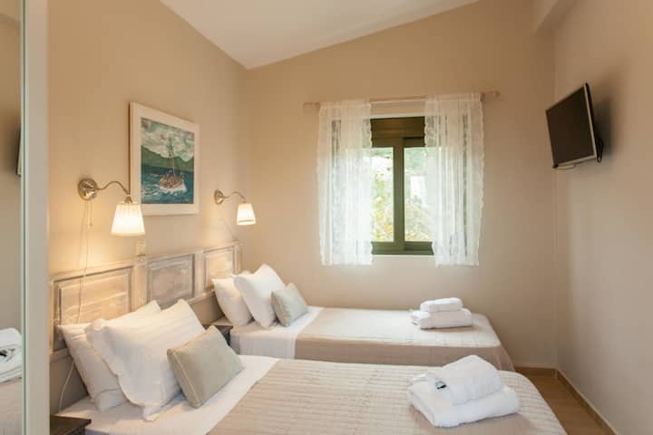 Inviting Twin Bedroom with Smart TV