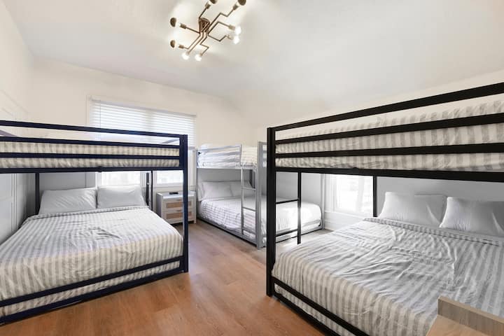 Upstairs bedroom. Three full over full bunkbeds totaling six full beds, with closet in the corner