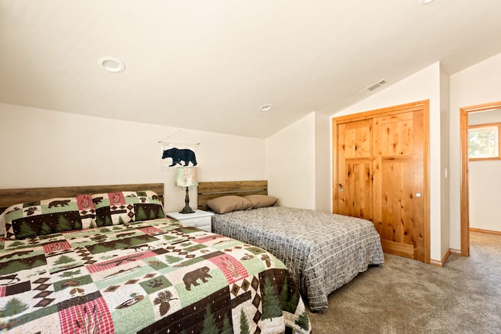 Third bedroom featuring a Smart TV for streaming.