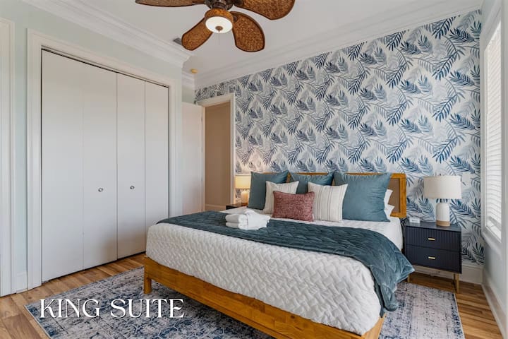 Relax and unwind in this cozy, sunlit bedroom with plush linens and a tranquil ambiance