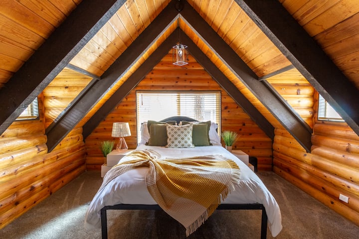 This cozy room is situated upstairs. It has an attached bathroom. 