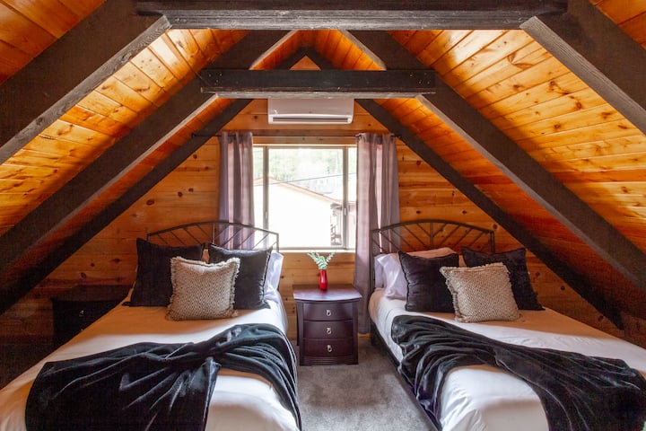 Upstairs, right off the loft, you'll find this room which has an attached 1/2 bath