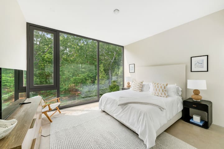 Sink into relaxation in a peaceful bedroom retreat, where the quiet surroundings and comfortable ambiance offer a sanctuary from the outside world.