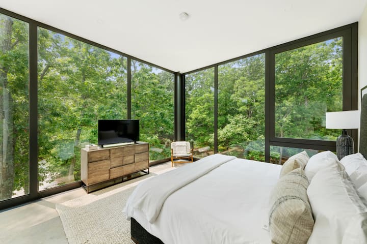 Let the stresses of the day drift away in this peaceful bedroom haven, designed with tranquility in mind, from the soft bedding to the tranquil views.